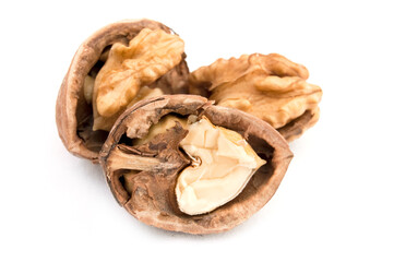 Walnut and split walnut with kernel inside on the white background