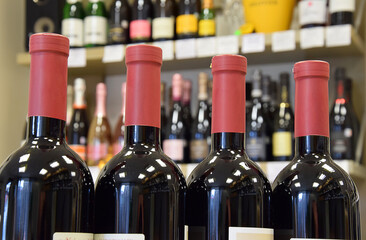 Wine bottles in wine store, restaurant, cafe, bar and ready for home delivery
