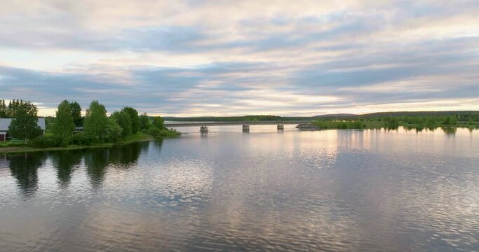 Tranquil River With Mirror Reflections During Sunset In Lapland, Sweden. Aerial Drone Shot