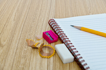 Pencil and notebook on the table