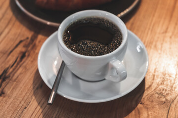 Obraz na płótnie Canvas Black coffee. White cup of filter coffee