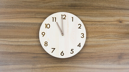 Retro wall clock on wooden background