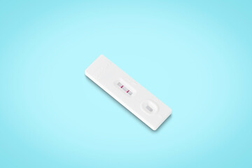 covid-19 positive test result. antigen (ATK) test kit​ isolated on​ light blue​ background with clipping path. top view. flat lay.