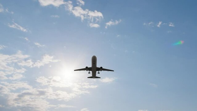 3840x2160. Airplane flies in sky at sunset day. Travel. Airplane takes off against the background of sunset. ULTRA HD. 