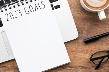 Notebook with 2023 goals text on it to apply new year resolutions and plan.