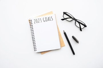 Notebook with 2023 goals text on it to apply new year resolutions and plan.