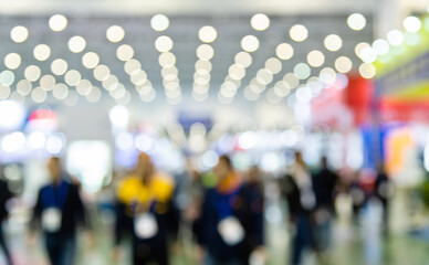 Obraz premium Large group of people walking in exhibition hall