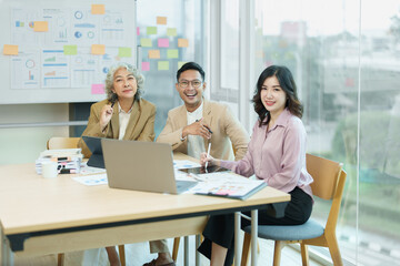Asian entrepreneurs and business people meeting in a conference room in business planning, financial budget and investment risk assessment to analyze customer groups to increase company growth