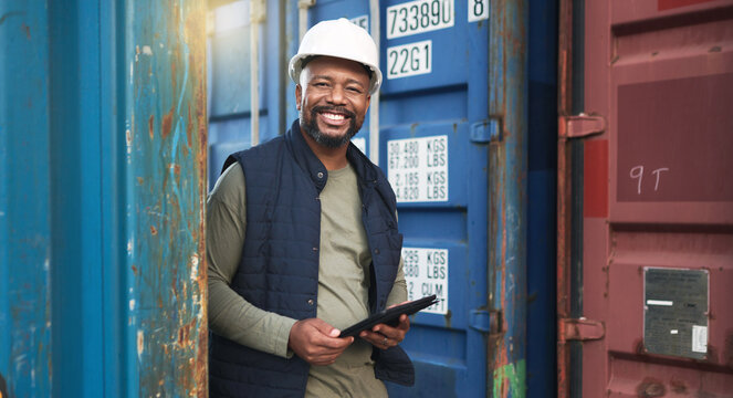 Supply chain, logistics and tablet with a black man delivery worker walking in a container yard for export. Ecommerce, shipping and internet with a male cargo employee working with freight or stock