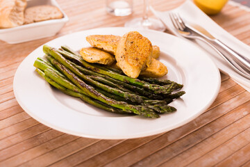 dietary meal rich in protein. Stir fried chicken breast and green asparagus