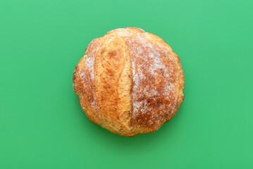 Loaf of bread on a green table, above view - Powered by Adobe