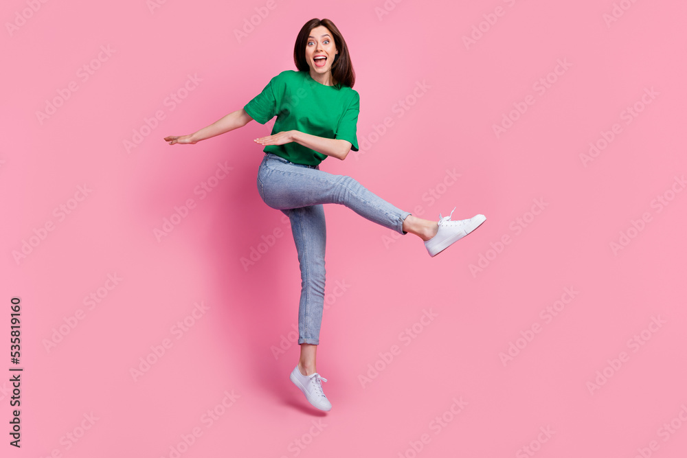 Sticker Full body photo of crazy carefree lady jumping dancing toothy smile isolated on pink color background