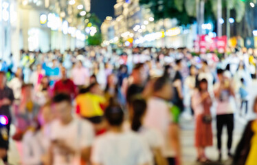 Obraz premium Crowd of people walking on the street