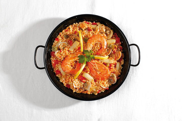 seafood paella and typical Spanish red peppers.