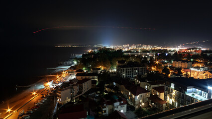 Fototapeta na wymiar view of the outskirts of Adler and Sochi with the sea coast in night