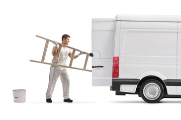 Painter putting a ladder in the back of a van