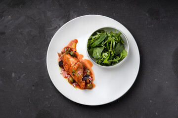 Chicken fillet stuffed with vegetables in tomato sauce