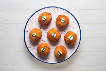 Tapa of typical Spanish croquettes. Made with bechamel and ham. Battered with bread and fried. Spanish gastronomy icon.