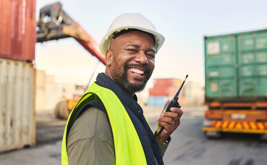 Logistics, communication and black man talking on walkie talkie while working at a storage port with container. Portrait of an African manufacturing manager speaking on tech while shipping cargo