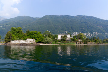Fototapeta premium Beautiful Brisago Islands seen from passenger ship on a sunny summer day. Photo taken July 25th, 2022, Brisago Islands, Switzerland.