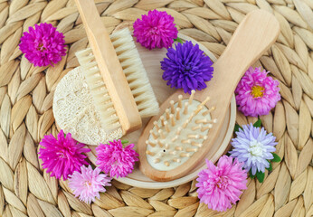 Wooden hair brush and massage body brush. Eco friendly toiletries. Natural beauty treatment, hair care or zero waste concept. Top view, copy space.