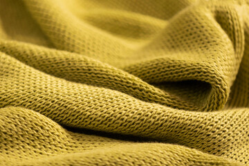 Warm cozy green knitwear closeup, texture background. Minimalism, copy space, place for text