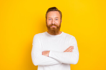 Photo of smiling experienced redhair expert guy wear white shirt crossed hands confident trainer ad isolated on yellow color background