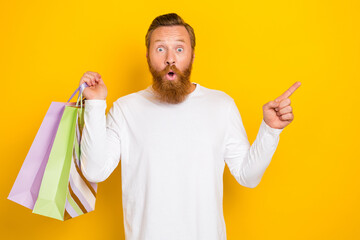 Photo astonished stylish man hand arm demonstrates empty space hot sale offer proposition cool...