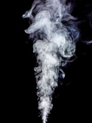 Swirling wisp of white smoke on a black