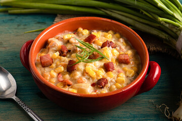 bowl of soup with sweet corn and bacon.