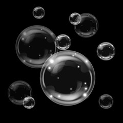Transparent bubbles on dark background