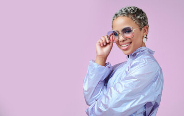 Fashion, sunglasses and black woman in vaporwave jacket on pink background in studio mock up space...