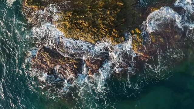 The texture of the stone beach at sunset 4 K