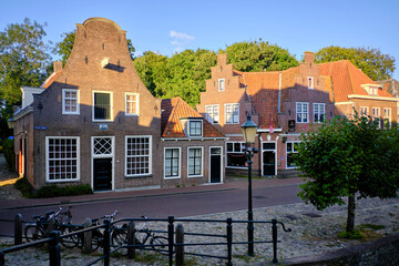 Amersfoort, The Netherlands, August 8, 2022. Traditional Dutch houses in an empty side streets on a quiet summer’s evening.