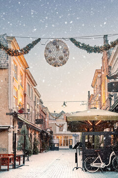 Winter view of bars and restaurants in the famous Korte Putstraat street in the city center of Den Bosch, The Netherlands