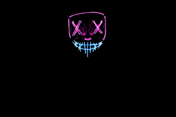 Purple and blue Halloween led mask with black background
