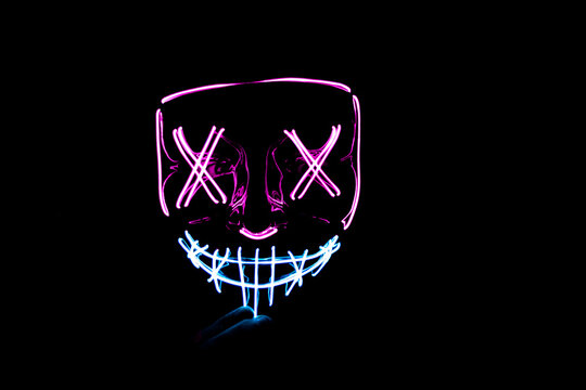 Purple and blue Halloween led mask with black background
