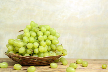 bunch of grapes on wooden table