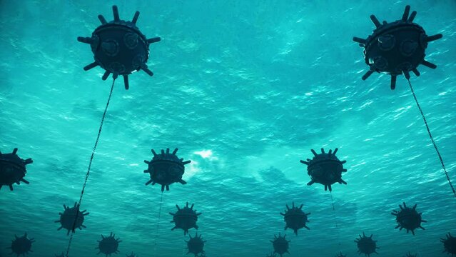Sea mines with grounding chains as viewed from underwater.