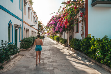 Young tourist walking by a pintoresque village in Gran Canaria