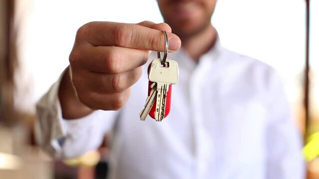 Person Holding Keys - Real Estate Concept