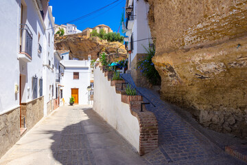 Setenil de las Bodegas. Typical andalucian village with white houses and sreets with dwellings built into rock overhangs above Rio Trejo. Andalusia. Spain © gatsi