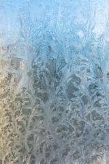 Frozen winter window with shiny ice frost pattern texture. Christmas wonder symbol, abstract background. Extreme north low temperature, natural Ice snow on frosty glass, cool winter weather outdoor