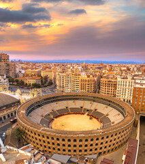Aerial view of Valencia city, Spain at sunset with bull arena.
