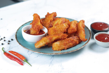 Potatos wedges with tomato sauce served in dish isolated on background side view of fastfood