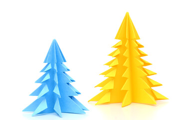 Obraz premium Two paper christmas trees on white