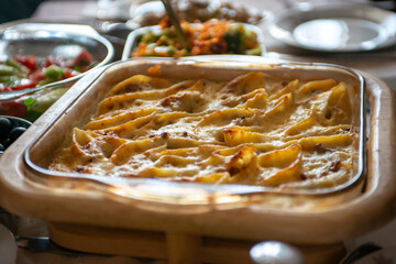 Baked vegetables served in trays, cozy homemade food.