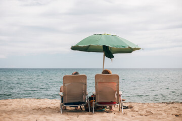 beach chairs and umbrella