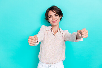 Fototapeta premium Photo of cheerful playful lady imagine hand arm hold wheel drive own new car enjoy road view trip isolated on cyan color background