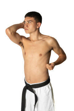 A Shirtless 19 Year Old Practacing a Karate Elbow Strike